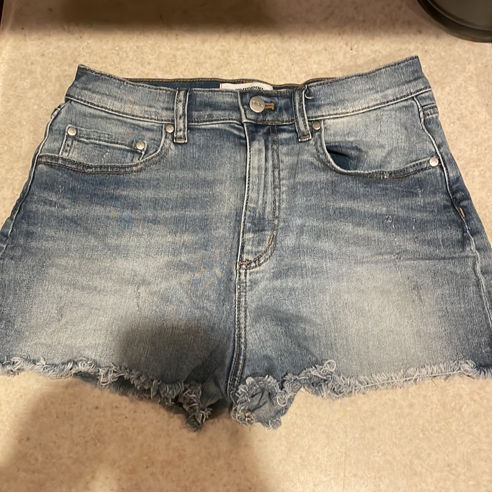 Distressed fringed jean shorts by pink. Light blue